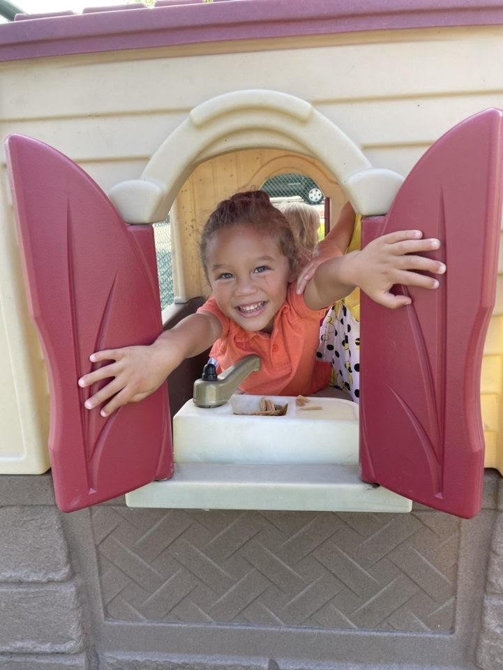 A River Preschool student playing on the preschool playground